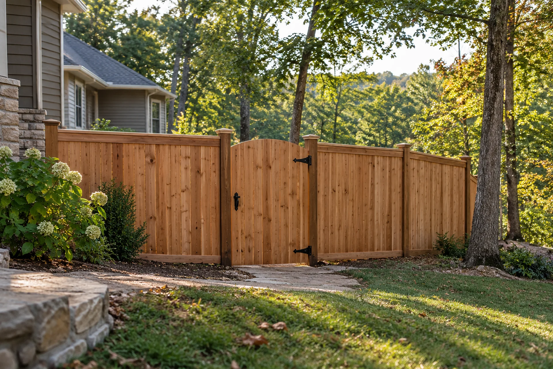 Custom cedar privacy fence and gate on a wooded Mid-Missouri property