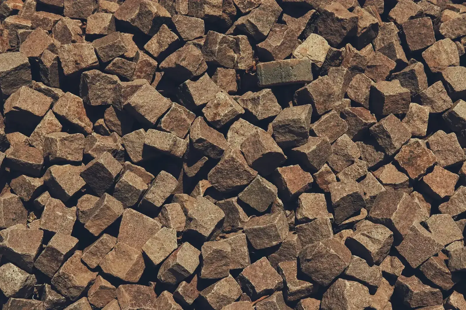 Close view of brown stone pavers showing natural texture and pattern